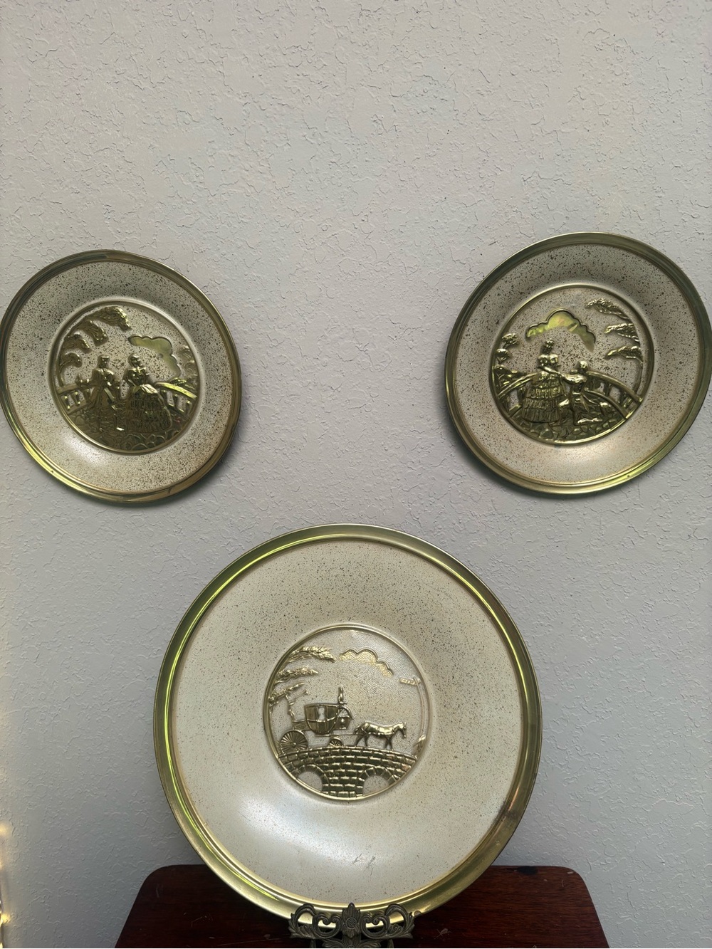 Vintage brass romantic scene plates.    (X’s 3)